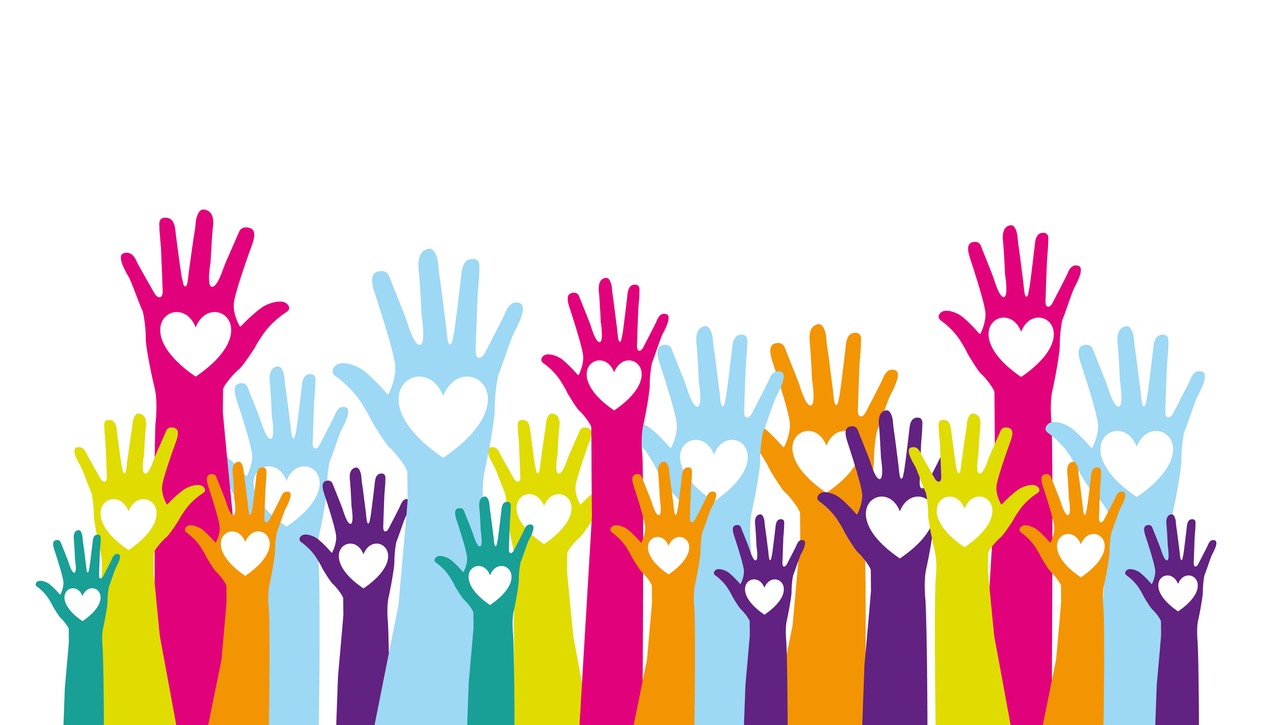 Colorful hands up with hearts over.